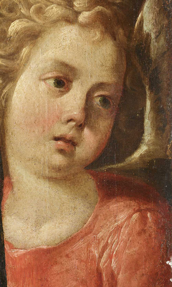 Rostro del ángel que acompaña a la Virgen.